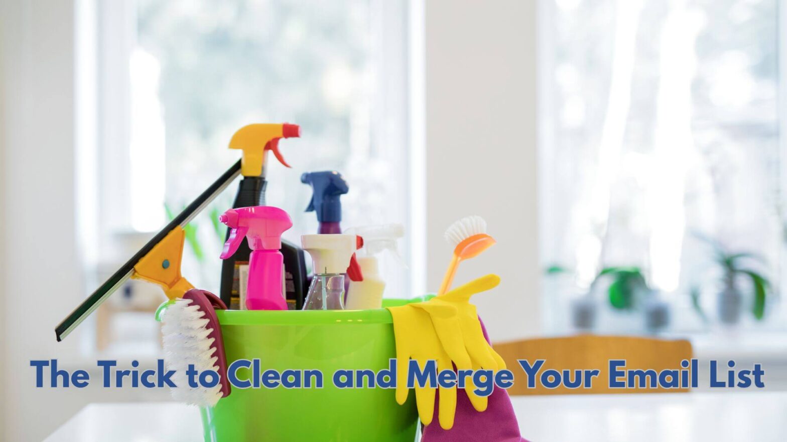 A green bucket in a kitchen with cleaning supplies and yellow cleaning gloves